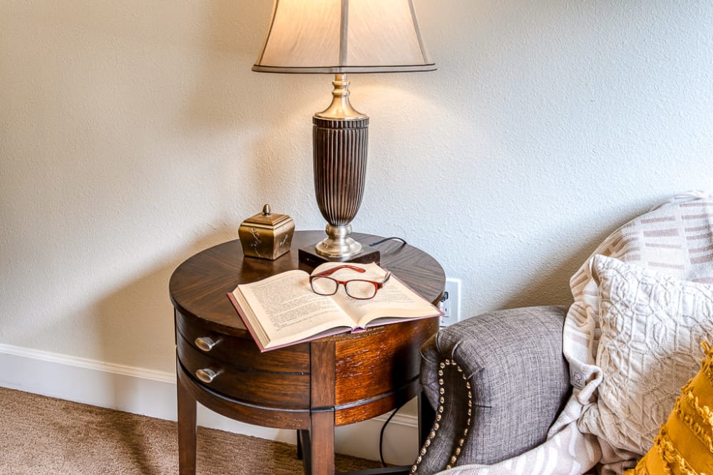 Side table with lampshade at Pacifica Senior Living Lynnwood in Lynnwood, Washington