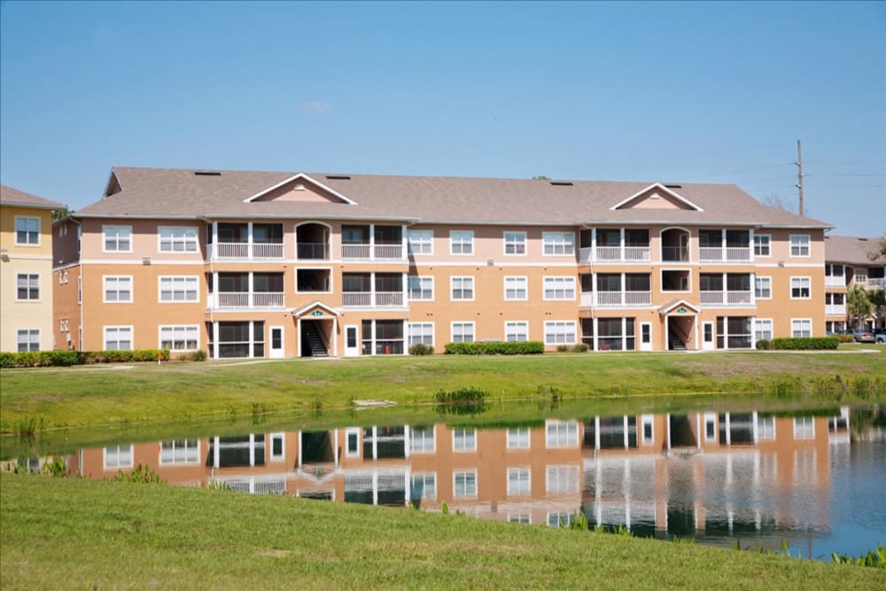 Exterior of the community by the lake at The Columns at Cypress Point in Wesley Chapel, Florida
