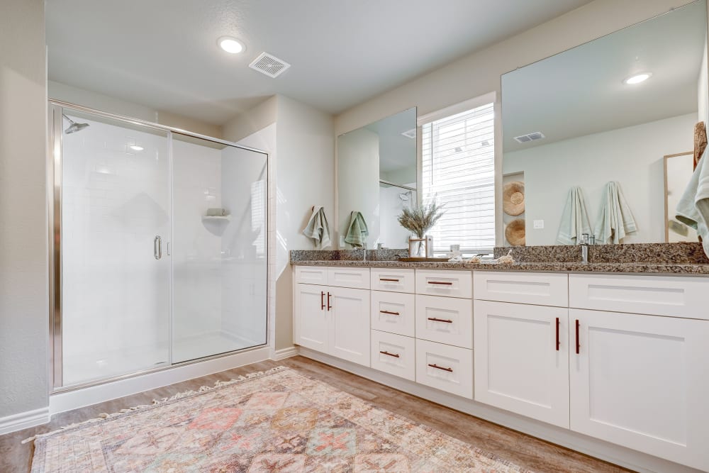 Bathroom with double sinks at BB Living Harvest in Argyle, Texas