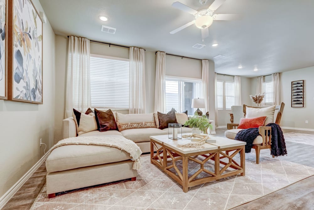 Model living room in a well lit home at BB Living Harvest in Argyle, Texas