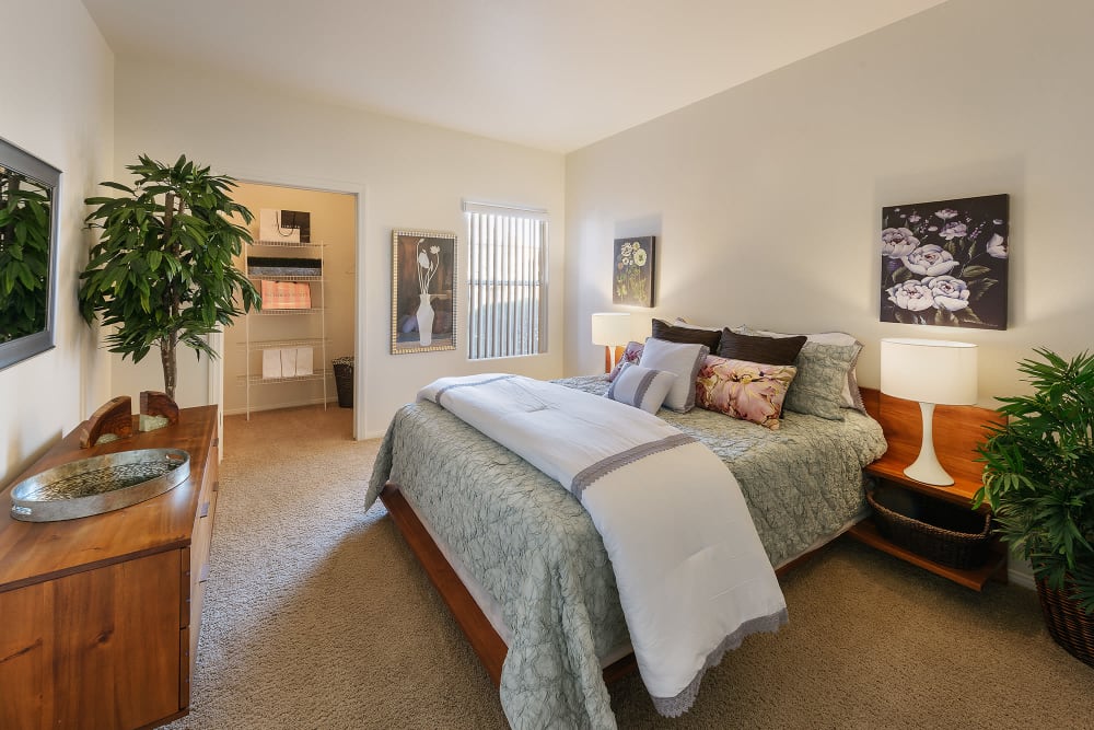 Large master bedroom with ceiling fan and beautiful furnishings in model home at Shadow Hills at Lone Mountain in Las Vegas, Nevada