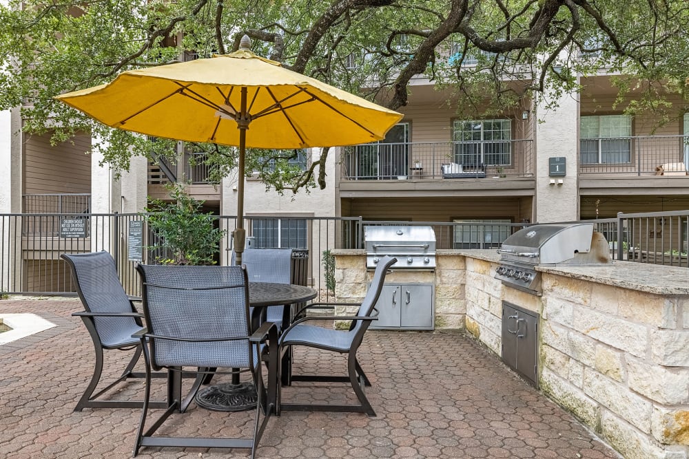 Outdoor Grill Stations and seating at Marquis at Ladera Vista in Austin, Texas