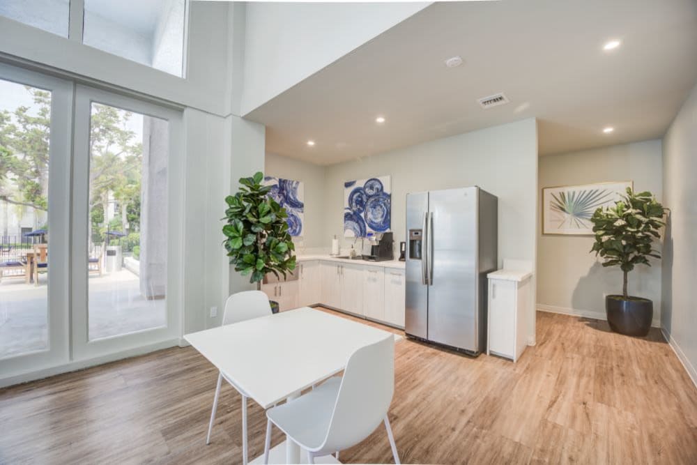 Open community room space with community kitchen at The Villas at Woodland Hills in Woodland Hills, California 