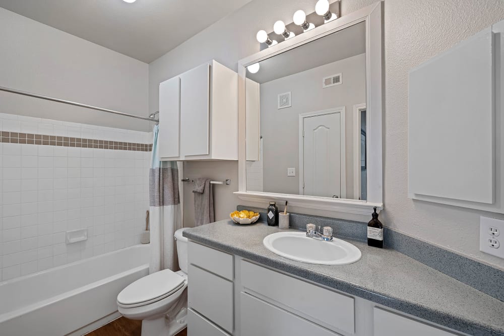 Apartment bathroom with Upgraded Lighting FixtureatMarquis Parkside in Austin, Texas