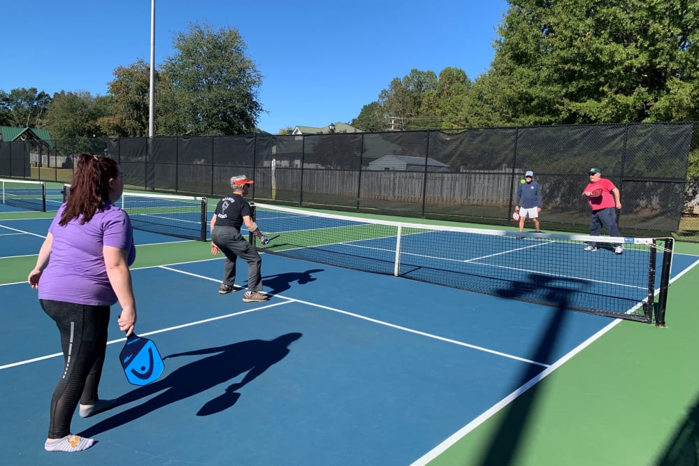 residents playing pickleball at The Foothills Retirement Community in Easley, South Carolina