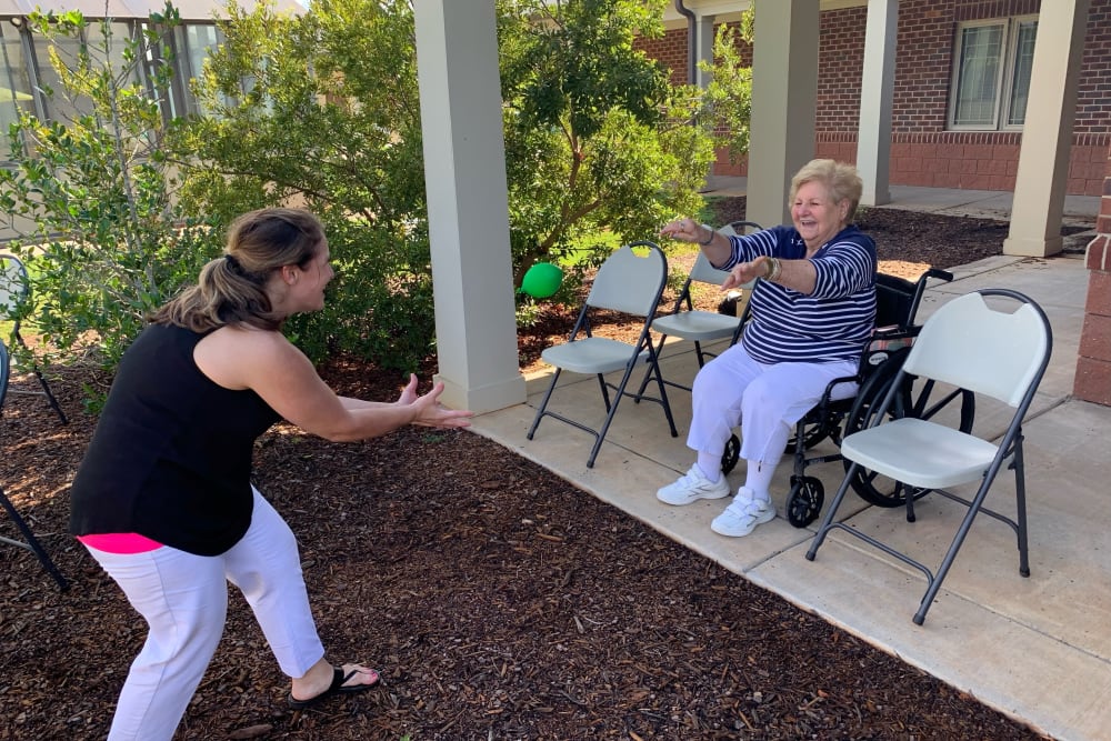 Resident playing catch at The Foothills Retirement Community in Easley, South Carolina