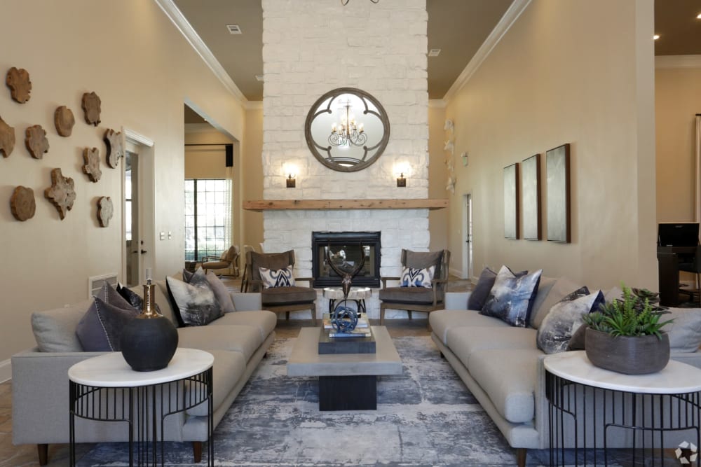 Upscale clubhouse with a fireplace at The Columns at Westchase in Houston, Texas