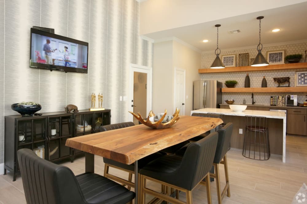 Kitchen and large table in the clubhouse at The Columns at Westchase in Houston, Texas