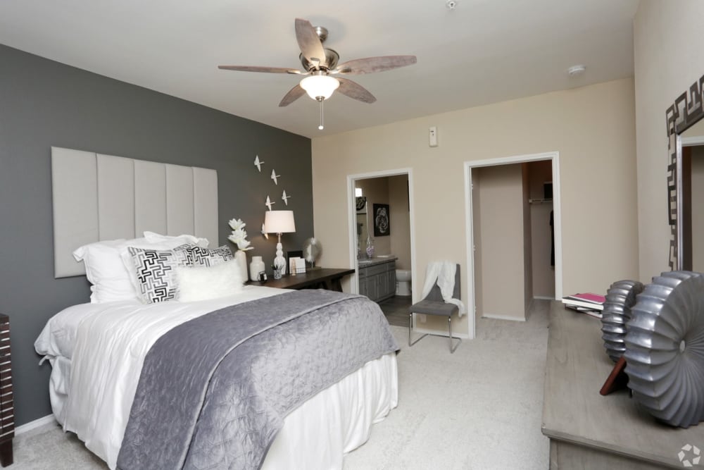 Model bedroom with attached bathroom at The Columns at Westchase in Houston, Texas