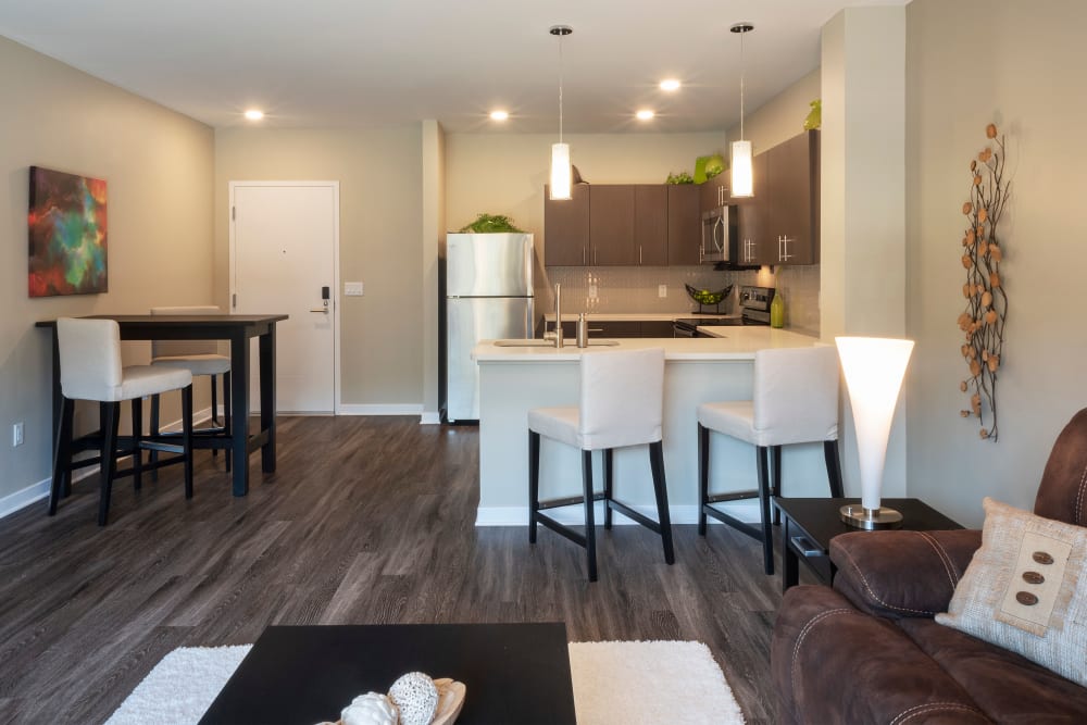 Open floor plan with wood flooring at Cosmopolitan Apartments in Pittsburgh, Pennsylvania