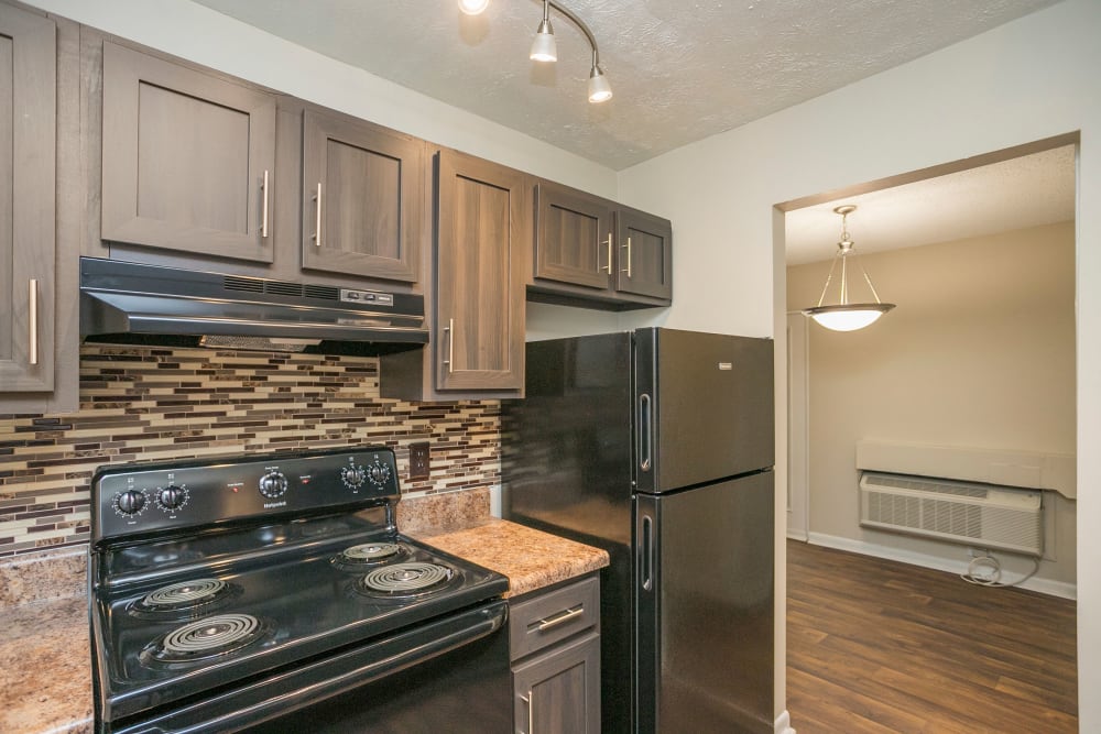 Fully-equipped kitchen with modern appliances at Candlewood Apartment Homes in Nashville, Tennessee