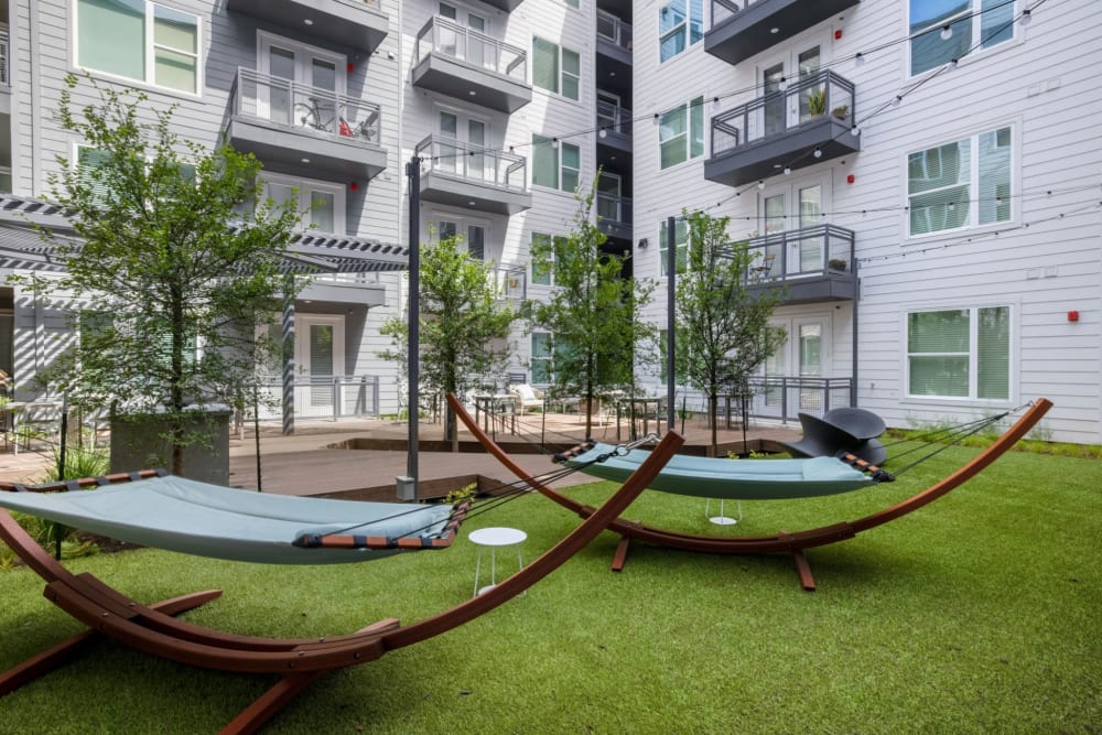 Exterior courtyard area with hammocks at 44 South in Austin, Texas