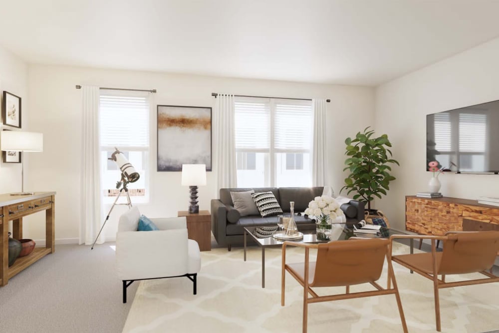 Spacious living room with large windows at The Collection at Scotland Heights in Waldorf, Maryland