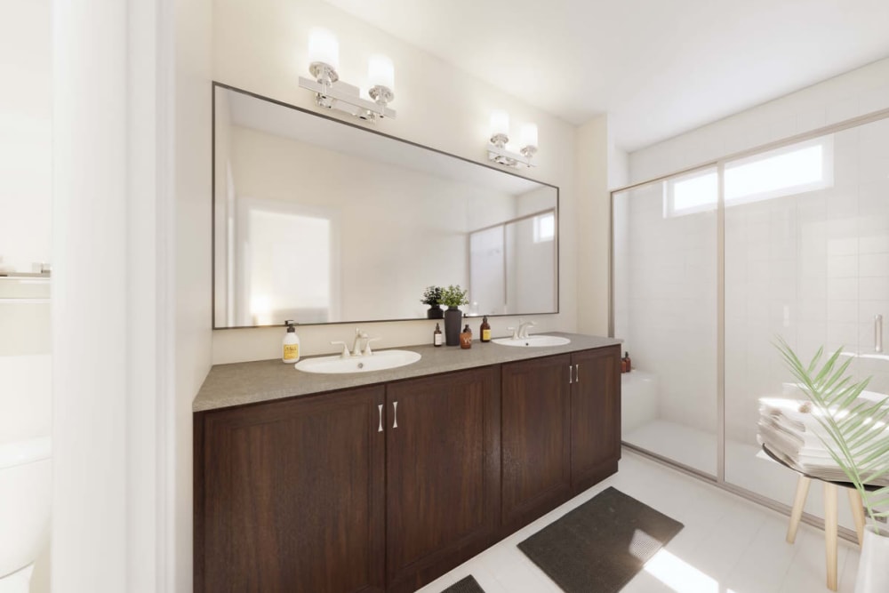 Bathroom with rich cabinetry at The Collection at Scotland Heights in Waldorf, Maryland