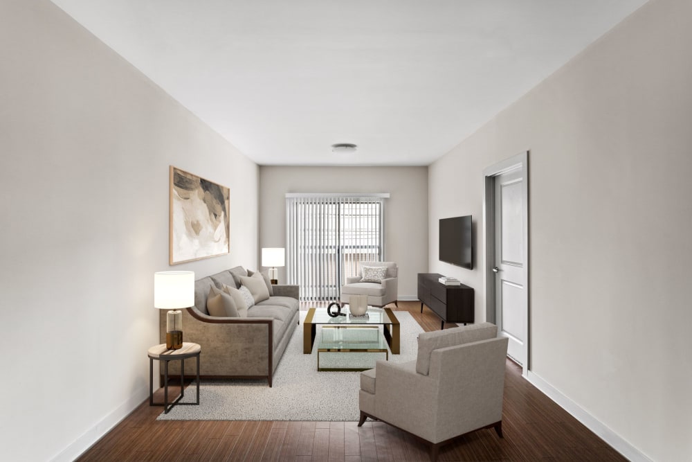 Living room with vinyl bamboo-style flooring at Olympus Midtown in Nashville, Tennessee