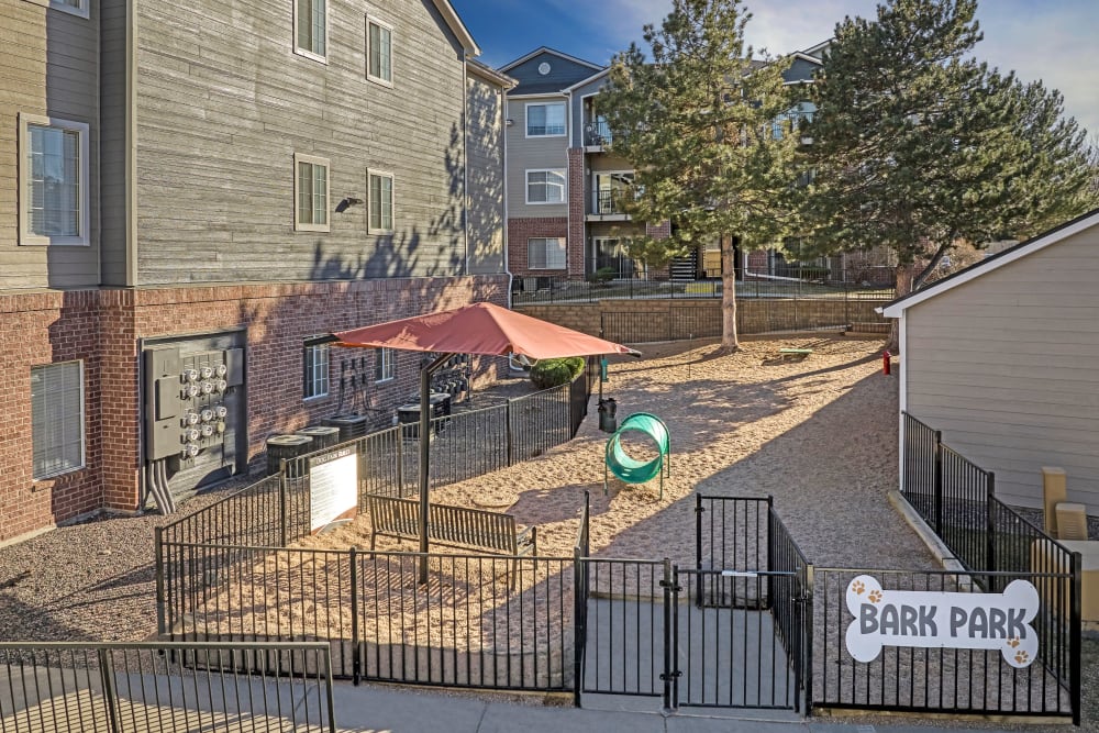 Have fun with your furry friend in the dog park at The Crossings at Bear Creek Apartments in Lakewood, Colorado