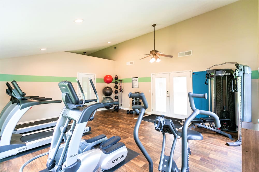 Large fitness center with high-quality machines at Magnolia Place Apartments in Franklin, Tennessee