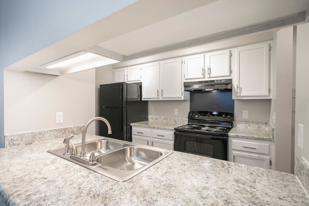 Open kitchen wall to breakfast bar at Pebble Creek Apartments in Antioch, Tennessee