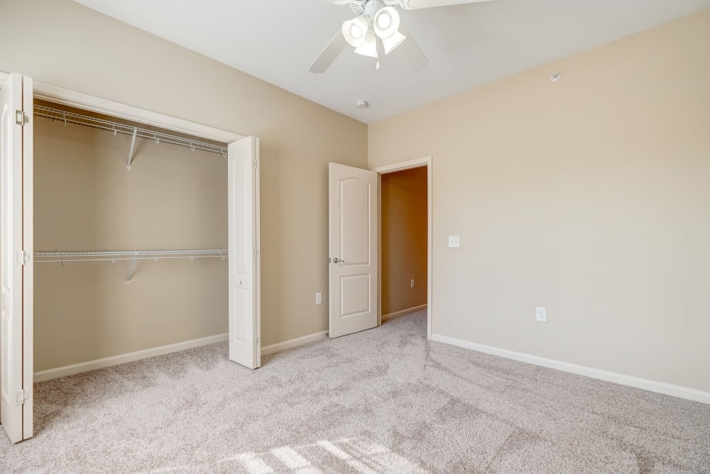 Bedroom and closet at Carden Place Apartment Homes in Mebane, North Carolina