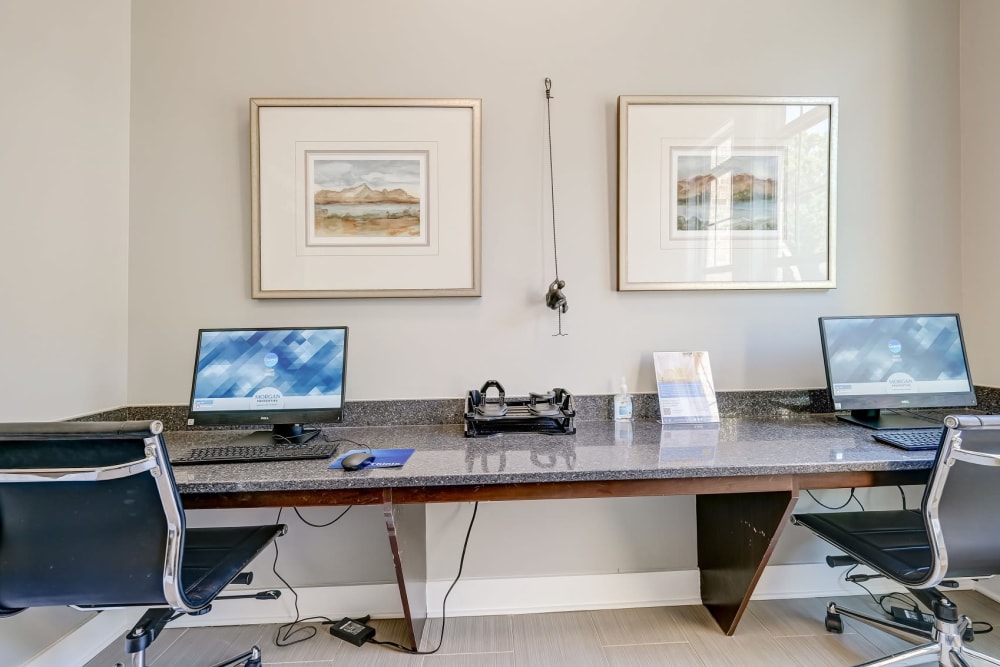 Computer workspace at clubhouse at Reserve at Kenton Place Apartment Homes in Cornelius, North Carolina