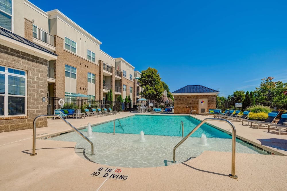 Outdoor swimming pool at Reserve at Kenton Place Apartment Homes in Cornelius, North Carolina