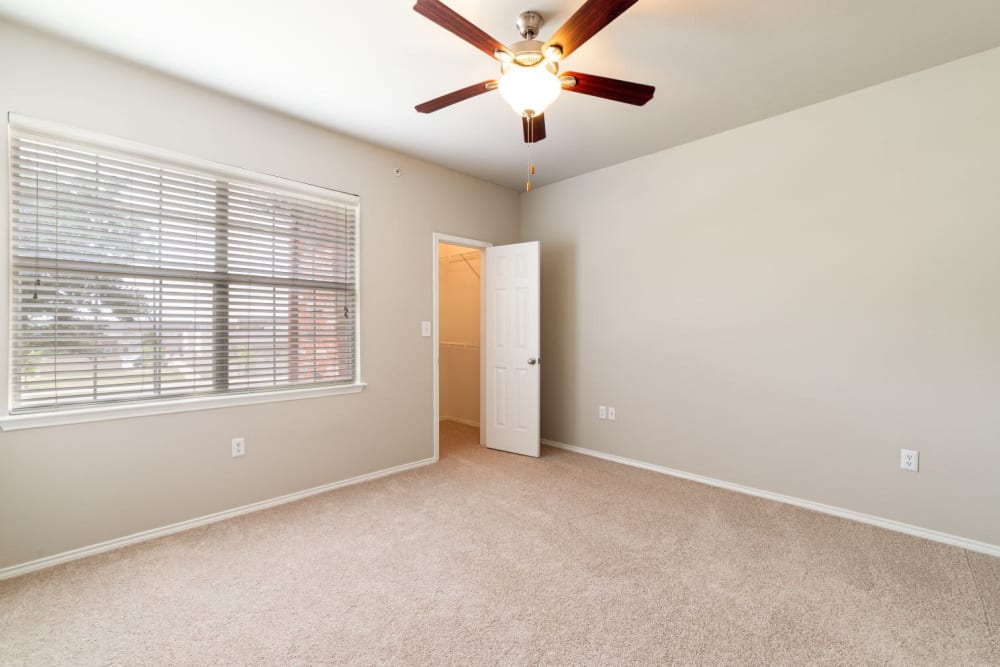 Bedroom with carpet and ceiling fan at Marquis at Stonebriar in Frisco, Texas