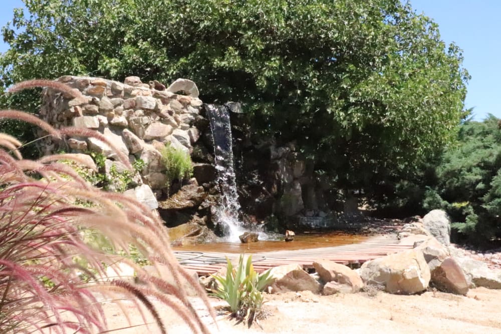 Decorative pond with waterfall at Sun City Gardens in Sun City, California