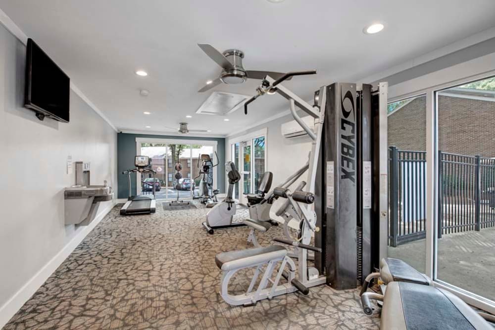A fitness center with individual workout stations at Mill Creek Flats in Winston Salem, North Carolina