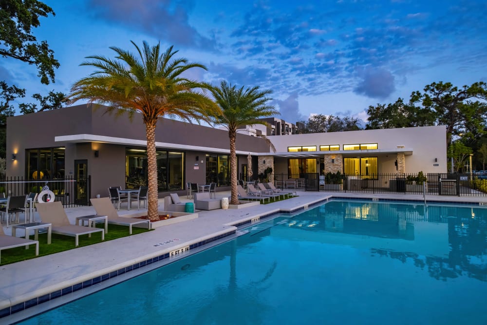 Swimming pool near twilight at Oak Enclave in Miami Gardens, Florida