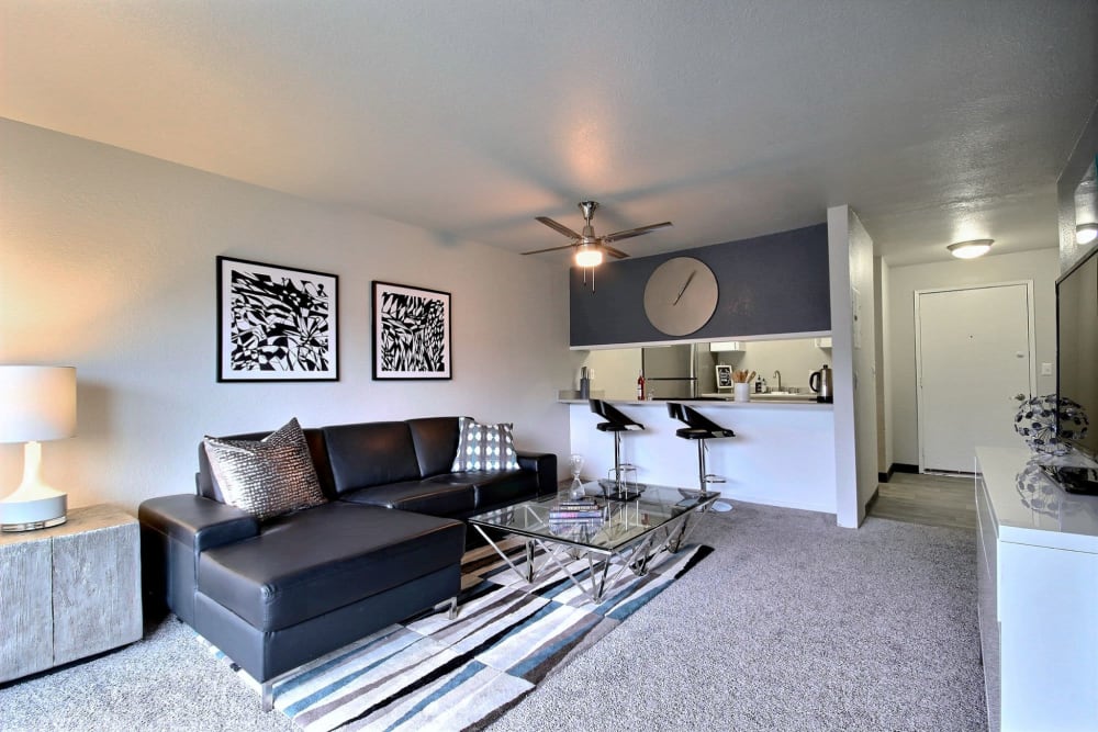 Comfortable living room with ceiling fan at Nova North in Everett, Washington