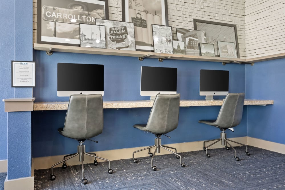 Business center with computers for resident use at Union At Carrollton Square in Carrollton, Texas