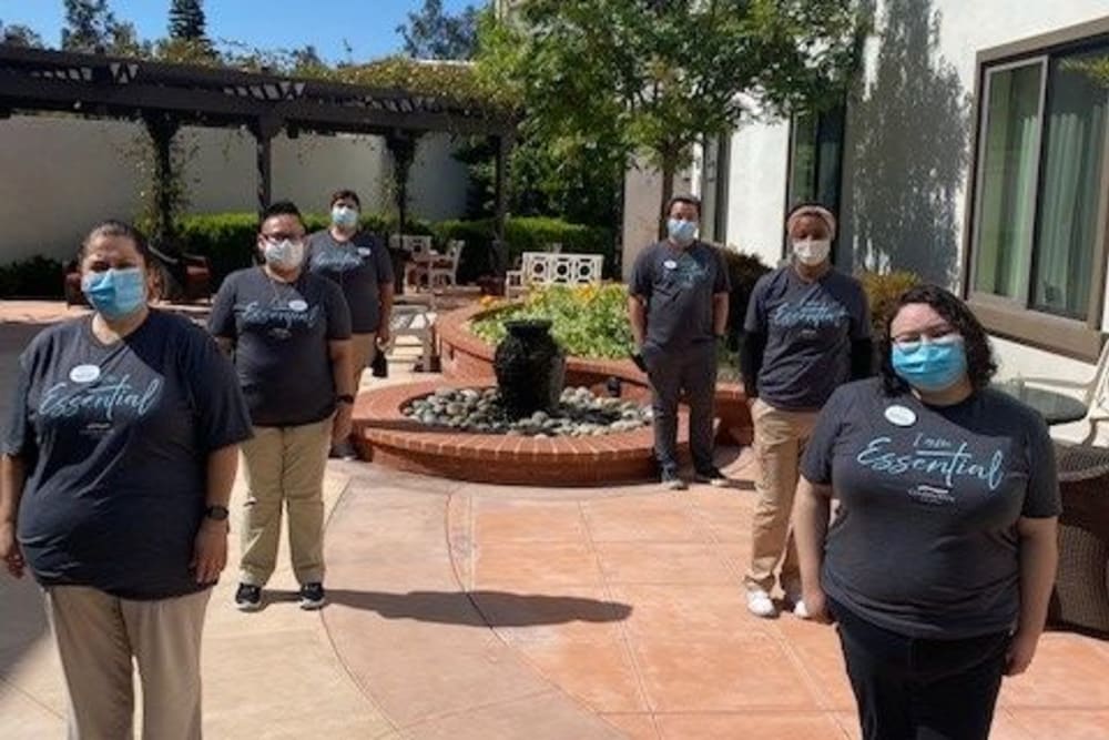 A group of staff members wearing protective masks