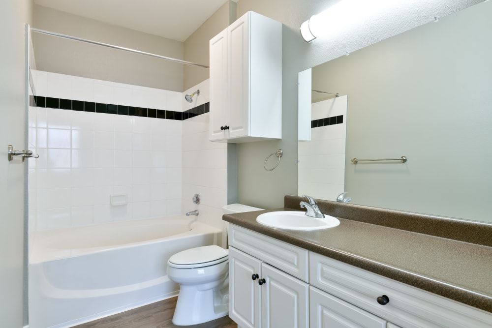 Model bathroom with lots of counter space at Emerald Park Apartment Homes in Dublin, California