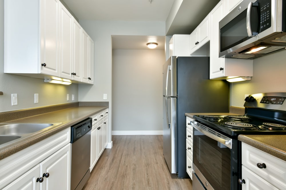 Model kitchen with stainless-steel appliances at Emerald Park Apartment Homes in Dublin, California