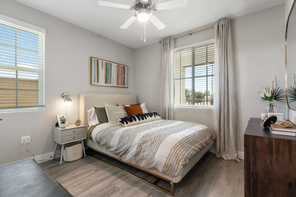 A bright, furnished bedroom at Alivia Townhomes in Whittier, California
