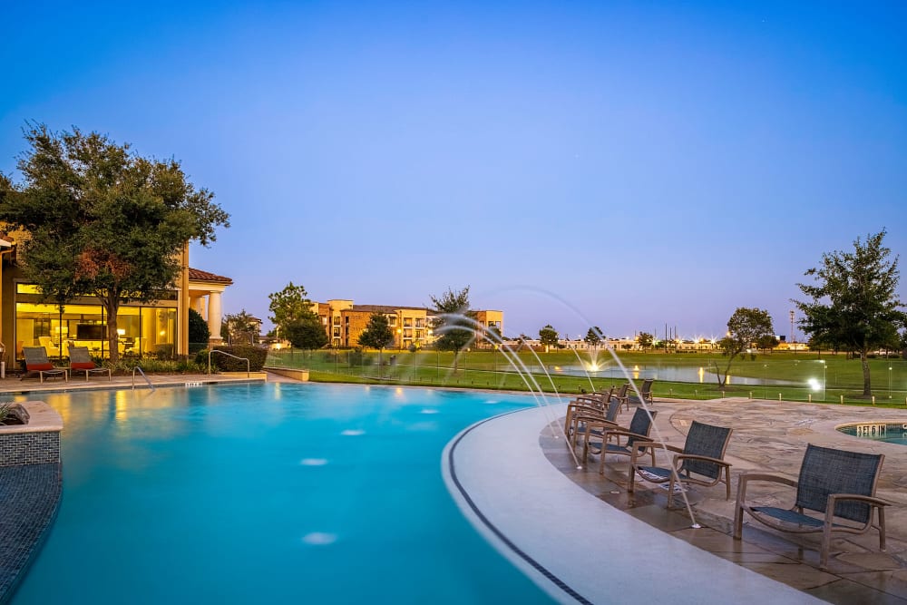 Sparkling pool with water features at Marquis at the Reserve in Katy, Texas