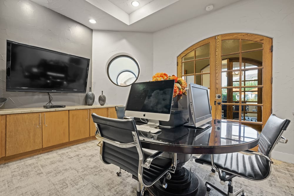 Executive business center with multiple work stations at Marquis at the Reserve in Katy, Texas 