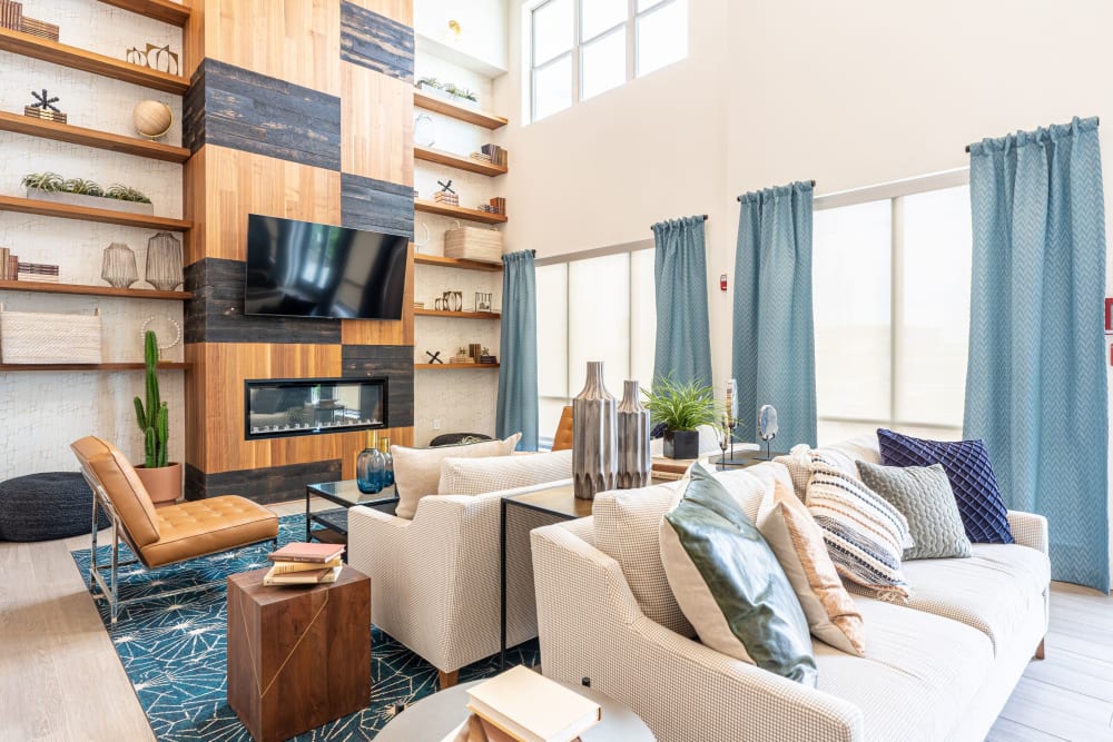 Community seating area with TV at The Everett at Ally Village in Midland, Texas