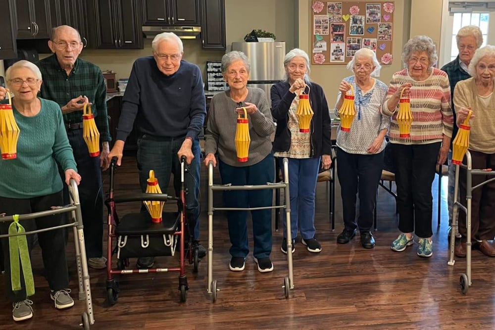 Group of residents and their walkers at Harmony Senior Services