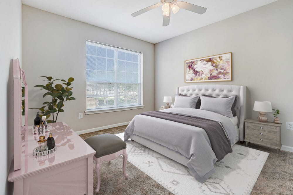 Bedroom with large window at Chateau des Lions Apartment Homes in Lafayette, Louisiana