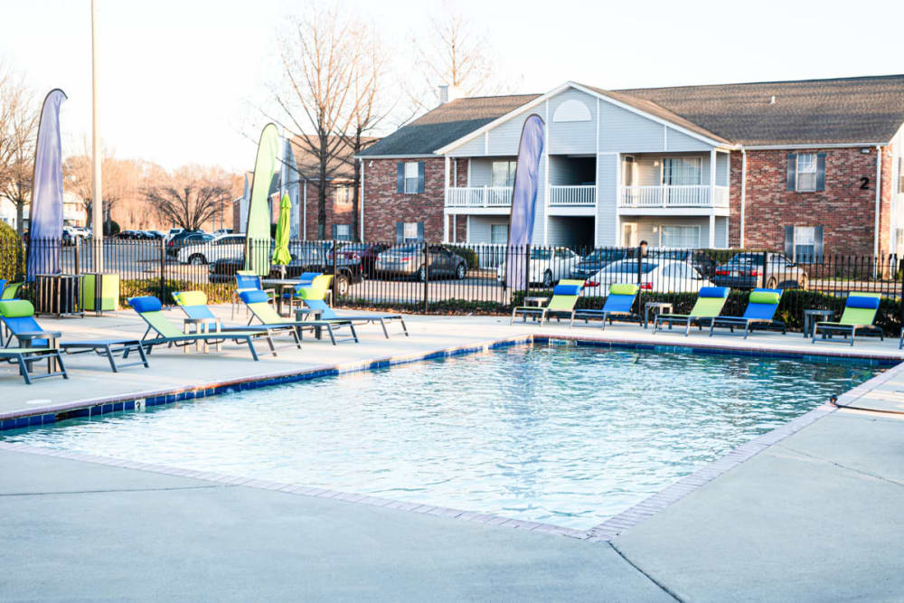 fenced pool area with tanning chairs at The Crescent at 161 in Walls, Mississippi