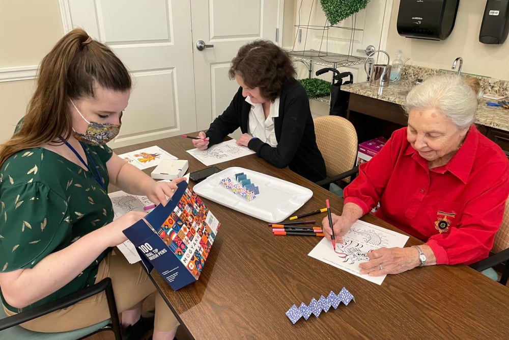 Residents drawing at Harmony Senior Services