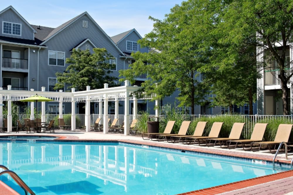 Large inground pool with lounge chairs at Artisan at Lawrenceville in Lawrenceville, New Jersey