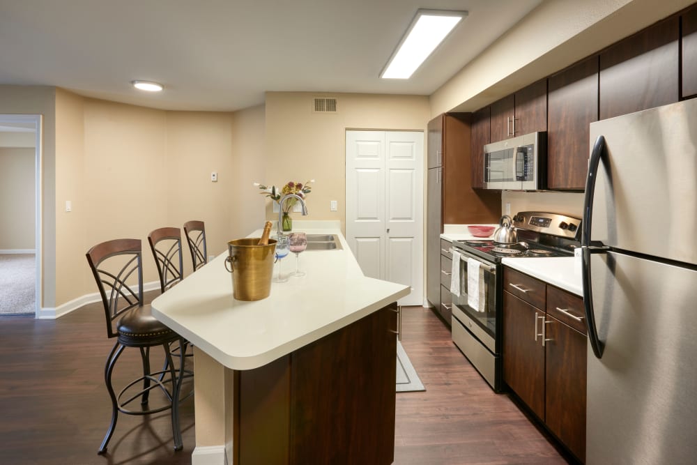 A kitchen with plenty of cabinet space at Villas at Homestead Apartments in Englewood, Colorado