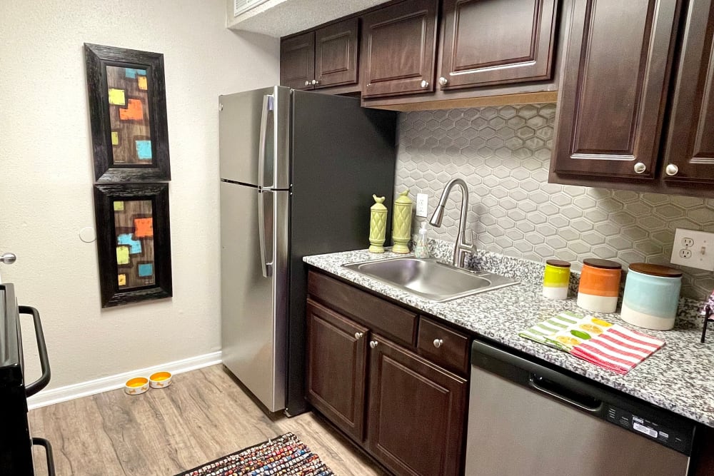 Kitchen with modern appliances at The Abbey at Montgomery Park in Conroe, Texas