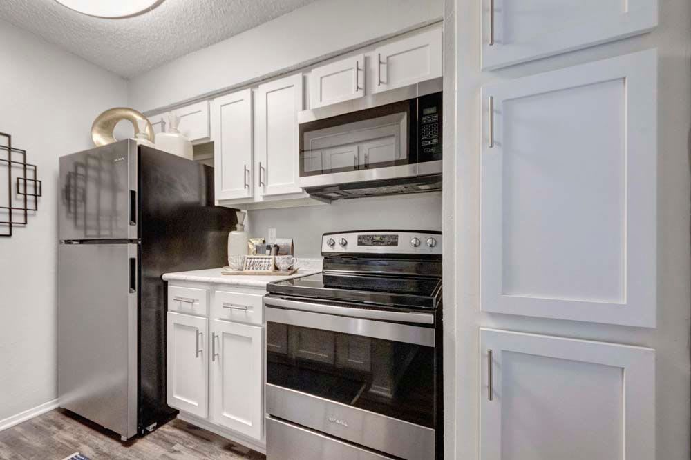 Clean and cozy kitchen area at The Fairway Apartments in Plano, Texas