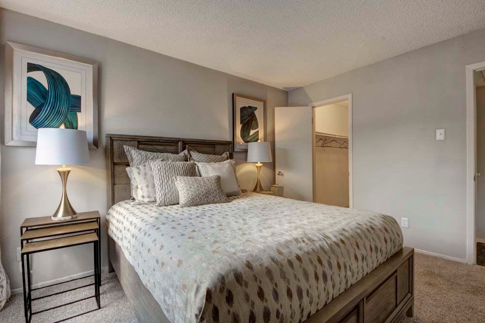 Warm and well lighted bedroom at The Fairway Apartments in Plano, Texas