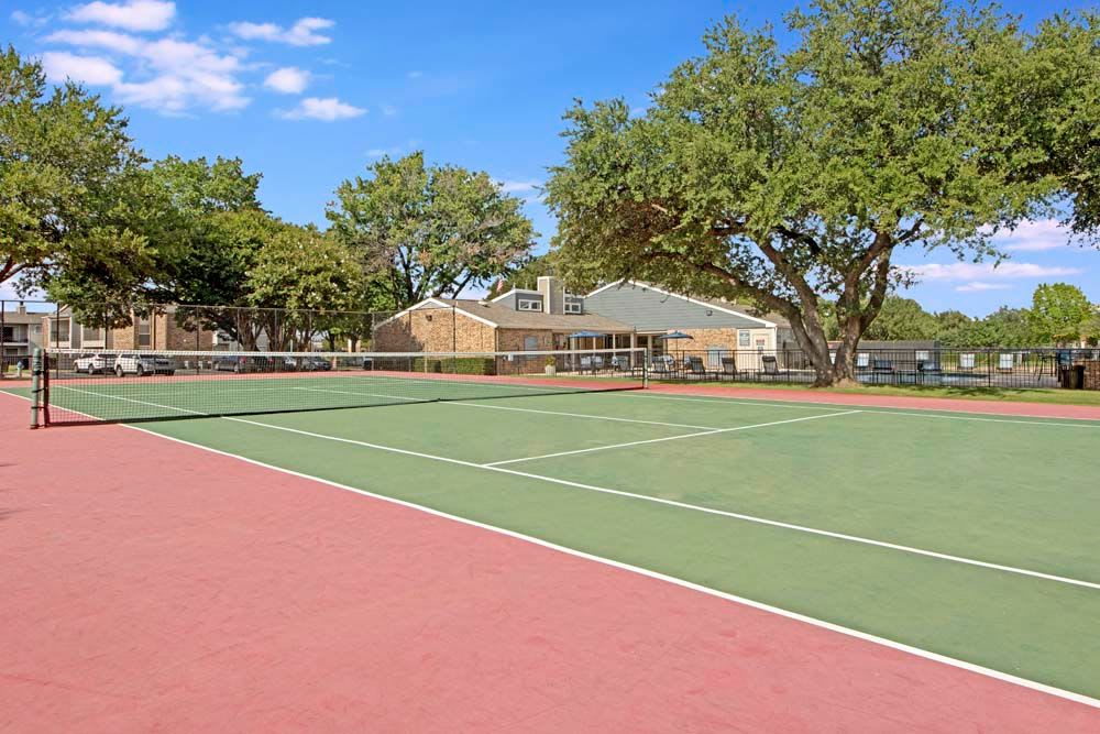 Grand Tennis area at The Fairway Apartments in Plano, Texas