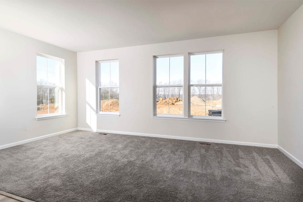 Living room space with window at The Collection at Scotland Heights in Waldorf, Maryland