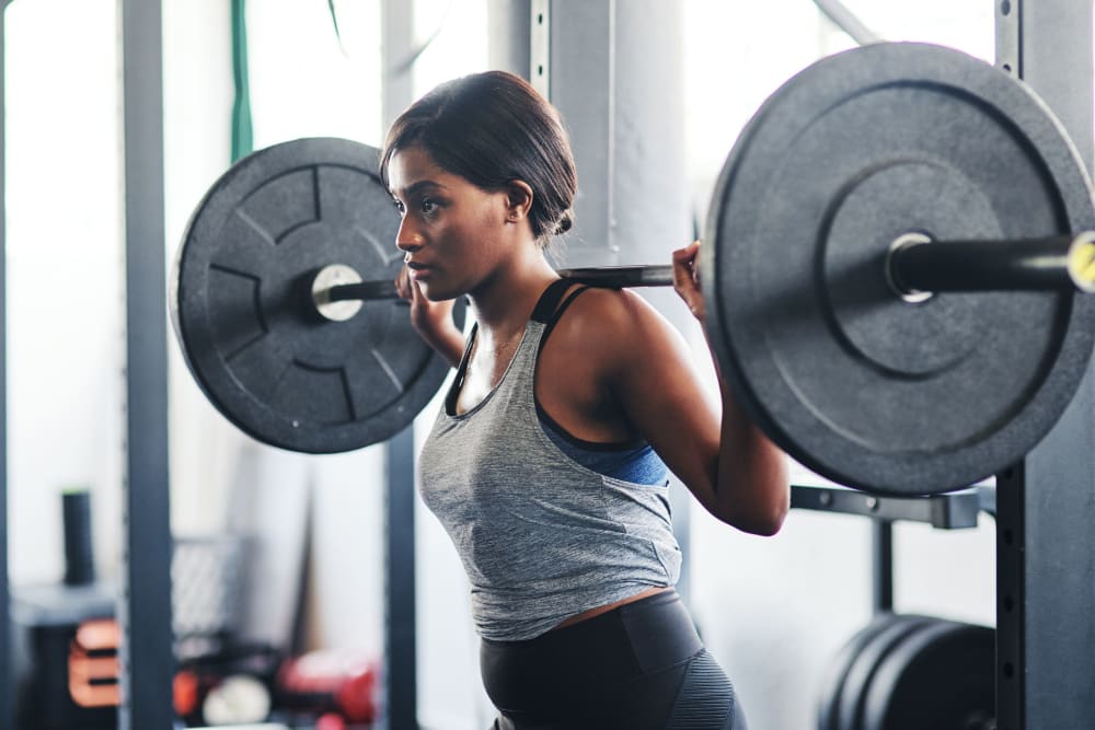 Resident using a squat bar at Olympus at Jack Britt in Fayetteville, North Carolina